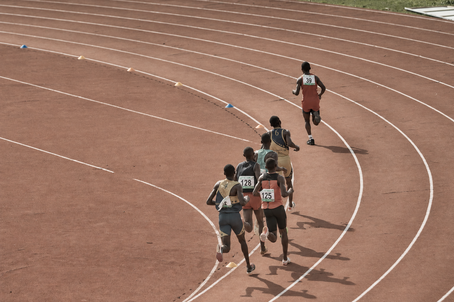 Runners competing on an athletics track